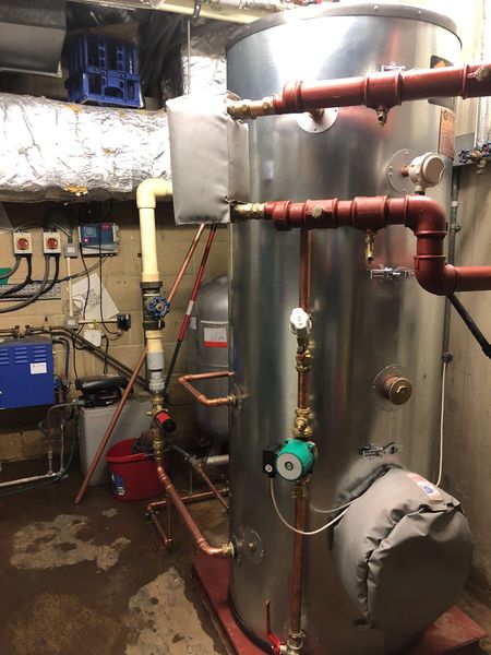New hot water cylinder with plate heat exchanger installed