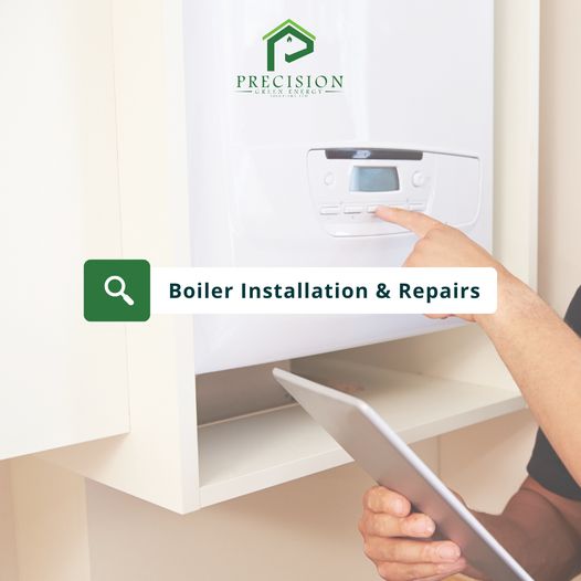 Boiler installation and repairs โ hand adjusting a boiler control panel, Precision Green Energy